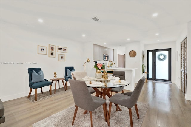 9905 NW 52nd Ln, Doral, FL 33178 - dining room featuring light wood-style flooring and recessed lighting