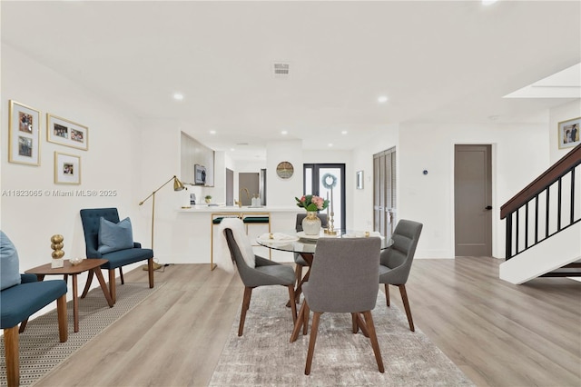 9905 NW 52nd Ln, Doral, FL 33178 - dining space with stairs, light wood-style floors, and recessed lighting