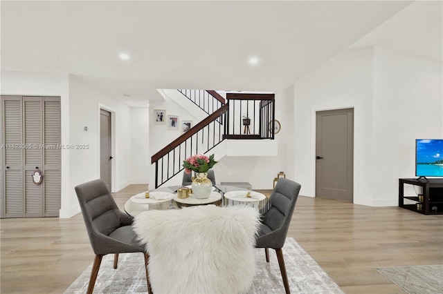 9905 NW 52nd Ln, Doral, FL 33178 - dining space featuring light wood-style floors, stairway, and recessed lighting