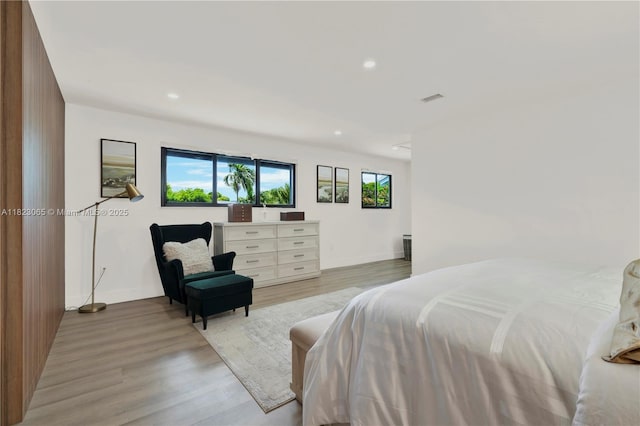 9905 NW 52nd Ln, Doral, FL 33178 - bedroom with light wood-style flooring and recessed lighting