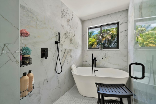 9905 NW 52nd Ln, Doral, FL 33178 - bathroom featuring tile walls, a soaking tub, and a marble finish shower
