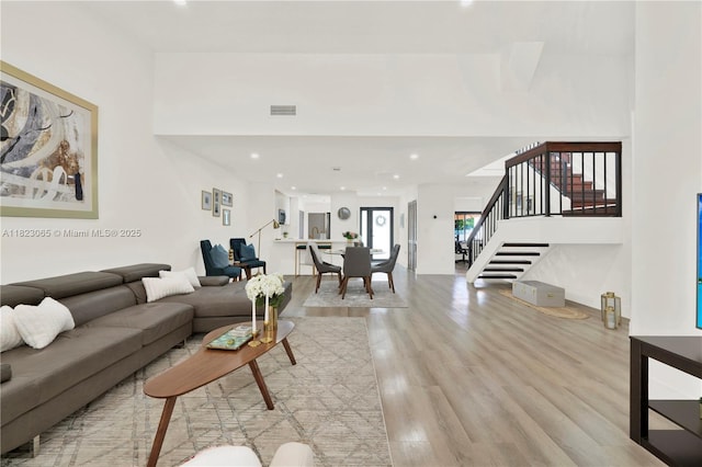 9905 NW 52nd Ln, Doral, FL 33178 - living area featuring stairs, light wood-type flooring, and recessed lighting