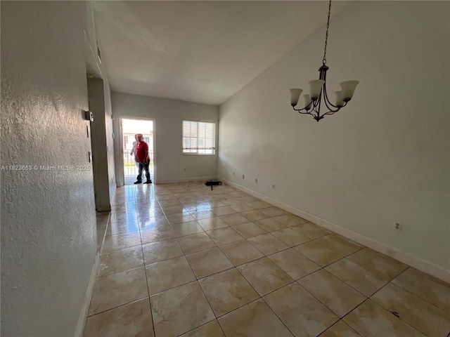 1250 SE 28th Ct Unit 203, Homestead, FL 33035 - unfurnished room with a chandelier, light tile patterned floors, and lofted ceiling