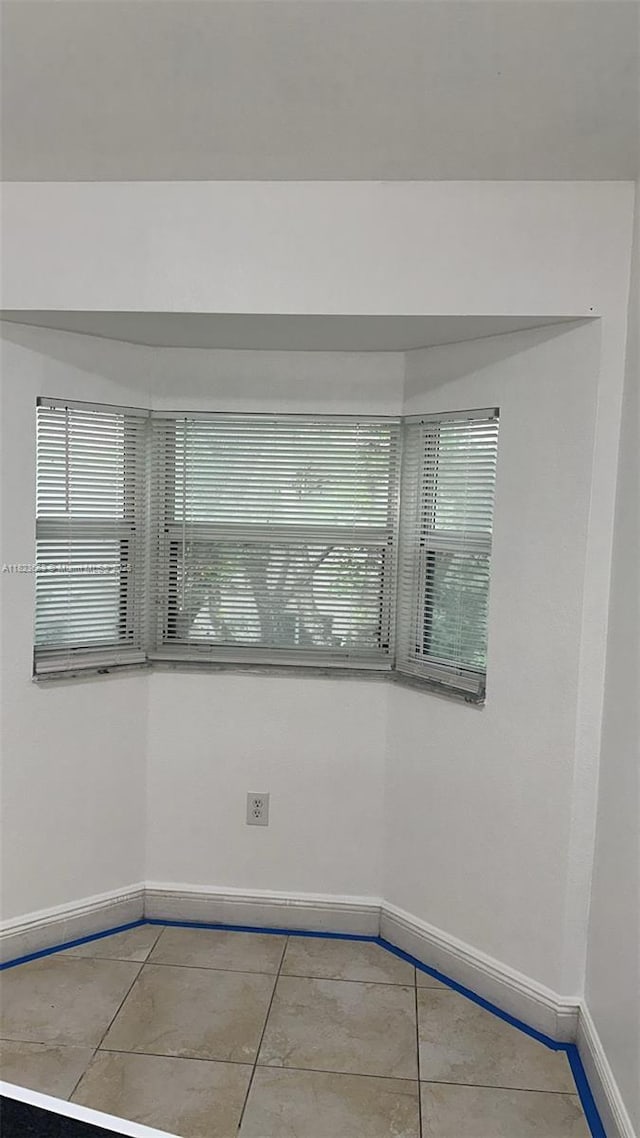 1250 SE 28th Ct Unit 203, Homestead, FL 33035 - spare room with tile patterned flooring