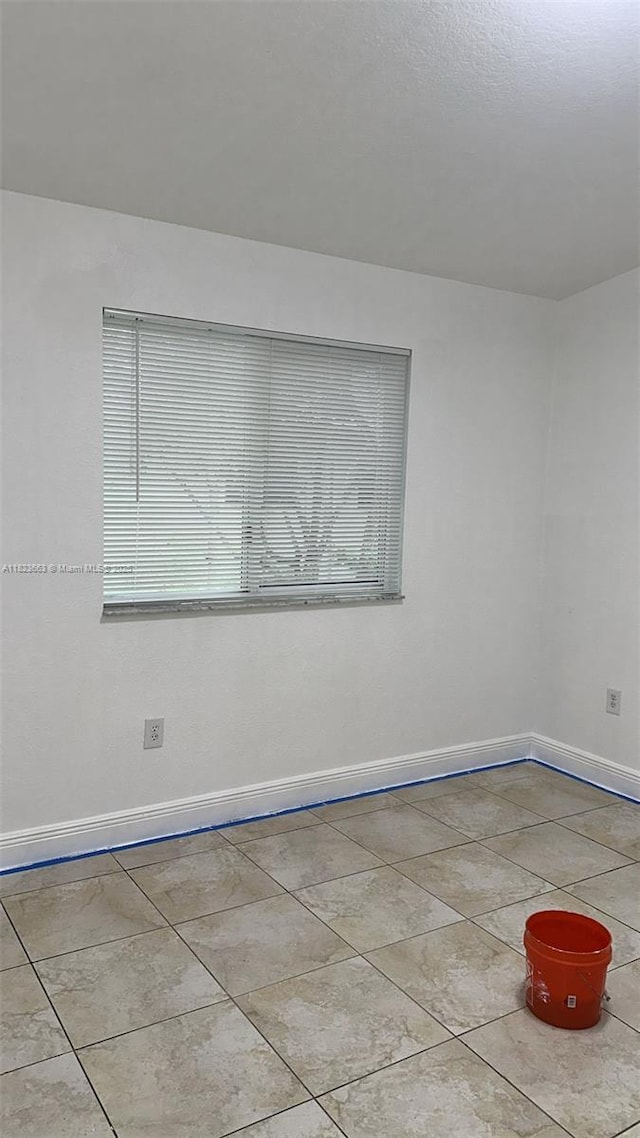 1250 SE 28th Ct Unit 203, Homestead, FL 33035 - unfurnished room featuring tile patterned flooring and baseboards
