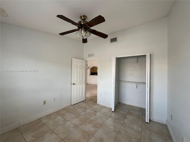 1250 SE 28th Ct Unit 203, Homestead, FL 33035 - unfurnished bedroom with light tile patterned floors, a closet, and ceiling fan