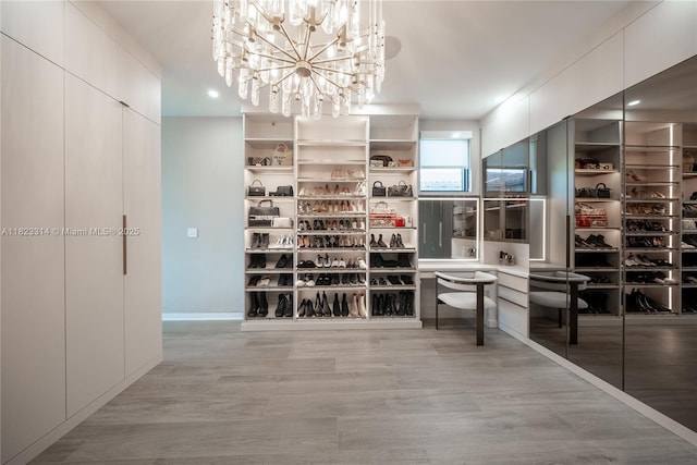 450 W 62nd St, Miami Beach, FL 33140 - spacious closet with a chandelier and light wood finished floors