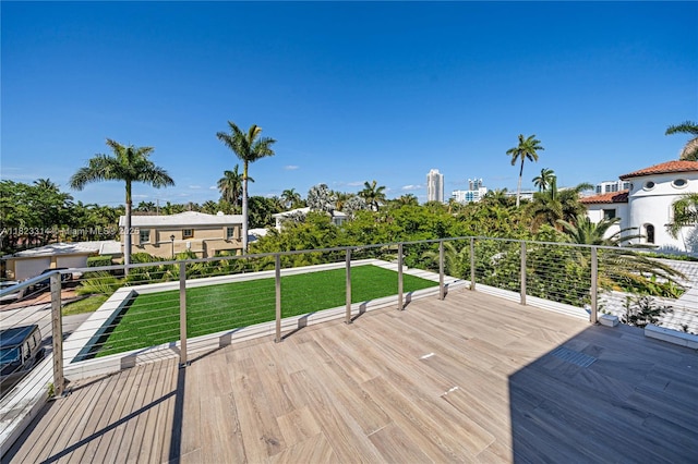 450 W 62nd St, Miami Beach, FL 33140 - wooden deck featuring a lawn