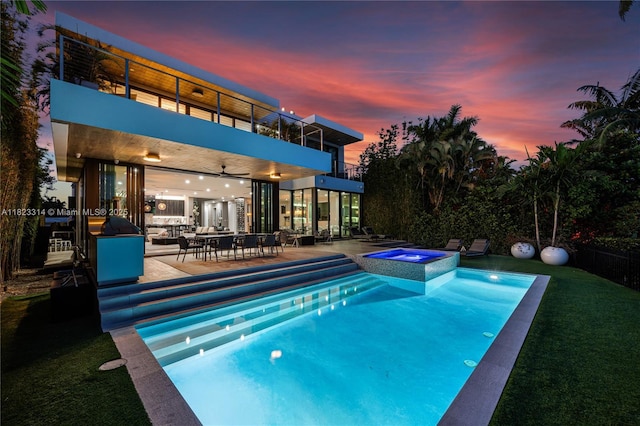 450 W 62nd St, Miami Beach, FL 33140 - view of swimming pool with a patio area, a pool with connected hot tub, and outdoor dining space
