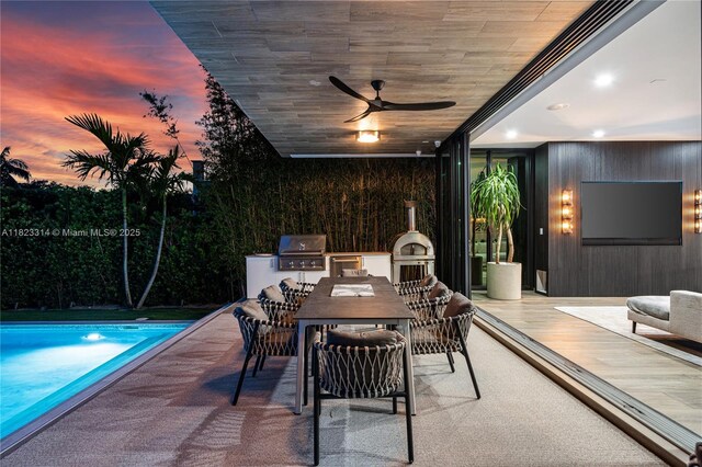 450 W 62nd St, Miami Beach, FL 33140 - view of patio with area for grilling, an outdoor pool, outdoor dining space, and ceiling fan