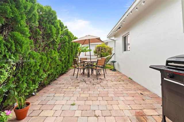 131 NW 31st Ct, Pompano Beach, FL 33064 - view of patio / terrace with a grill and outdoor dining space