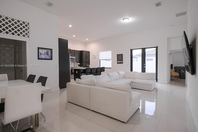 14659 SW 23rd Ter, Miami, FL 33175 - living room with light tile patterned flooring and recessed lighting