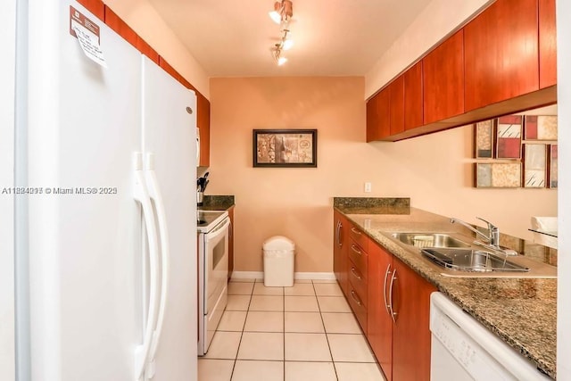 1200 Brickell Bay Dr Unit 1518, Miami, FL 33131 - kitchen with white appliances, brown cabinetry, and light tile patterned flooring