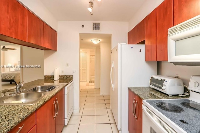 1200 Brickell Bay Dr Unit 1518, Miami, FL 33131 - kitchen featuring white appliances and light tile patterned flooring