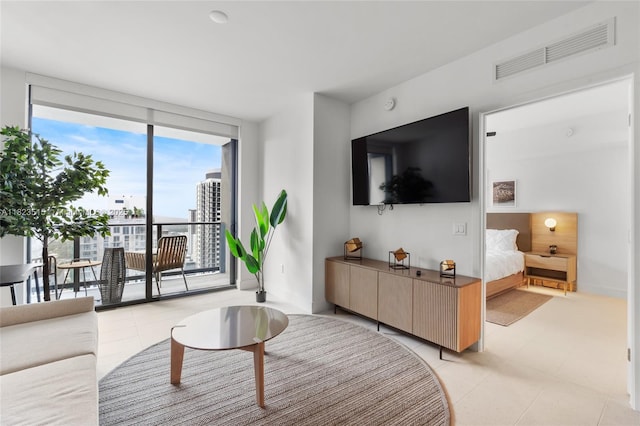 159 NE 6th St Unit 3104, Miami, FL 33132 - living area with expansive windows and light tile patterned flooring