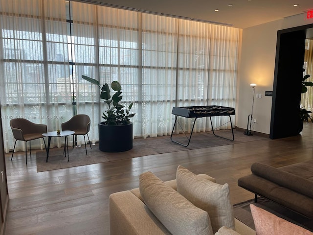 159 NE 6th St Unit 3104, Miami, FL 33132 - living room featuring wood finished floors and baseboards