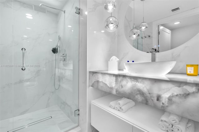 333 Las Olas Way Unit 804, Fort Lauderdale, FL 33301 - bathroom featuring a marble finish shower and vanity
