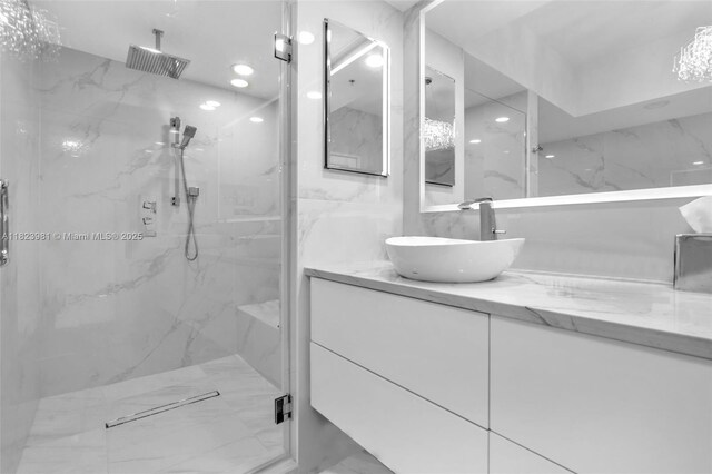 333 Las Olas Way Unit 804, Fort Lauderdale, FL 33301 - full bath with vanity, a marble finish shower, and marble finish flooring