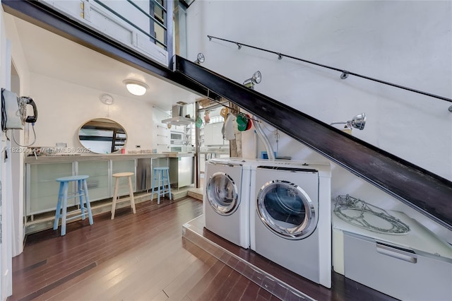 305 Jefferson Ave Unit 5, Miami Beach, FL 33139 - washroom with wood finished floors and separate washer and dryer