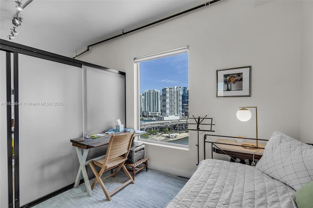 10 SW S River Dr Unit Phi03, Miami, FL 33130 - bedroom featuring wood finished floors, a city view, and a desk