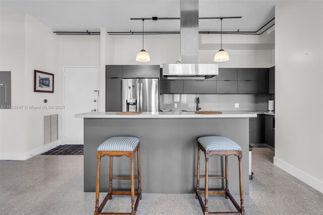 10 SW S River Dr Unit Phi03, Miami, FL 33130 - kitchen featuring stainless steel refrigerator with ice dispenser, modern cabinets, island range hood, a breakfast bar, and light countertops