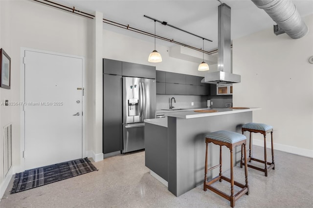 10 SW S River Dr Unit Phi03, Miami, FL 33130 - kitchen featuring island range hood, a kitchen breakfast bar, stainless steel fridge, modern cabinets, and light countertops