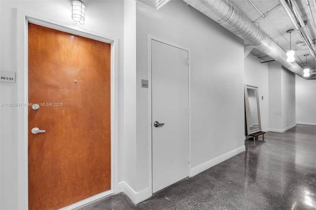 10 SW S River Dr Unit Phi03, Miami, FL 33130 - corridor featuring baseboards and finished concrete floors
