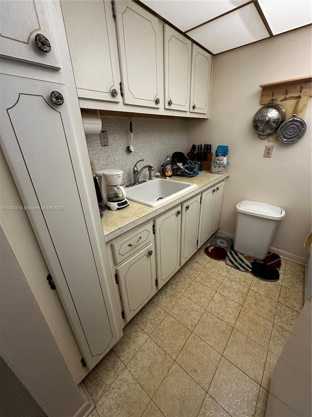 kitchen with light countertops and backsplash