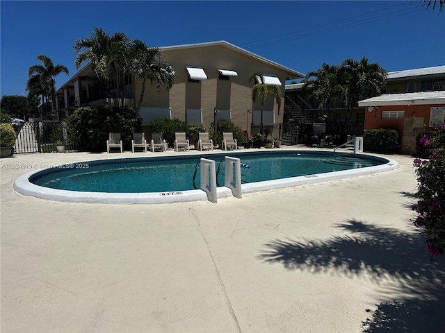 community pool with a patio