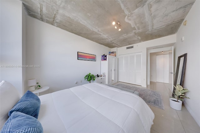 3250 NE 1st Ave Unit 1007, Miami, FL 33137 - bedroom with a closet and tile patterned floors