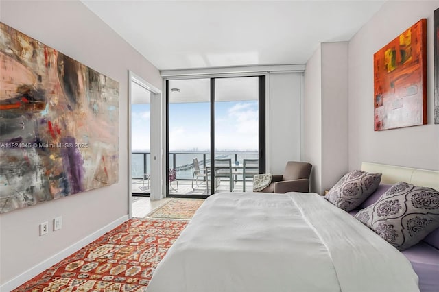 480 NE 31st St Unit 4804, Miami, FL 33137 - bedroom with floor to ceiling windows, access to exterior, and a water view
