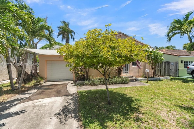 1521 Funston St, Hollywood, FL 33020 - view of property hidden behind natural elements with stucco siding, concrete driveway, and an attached garage