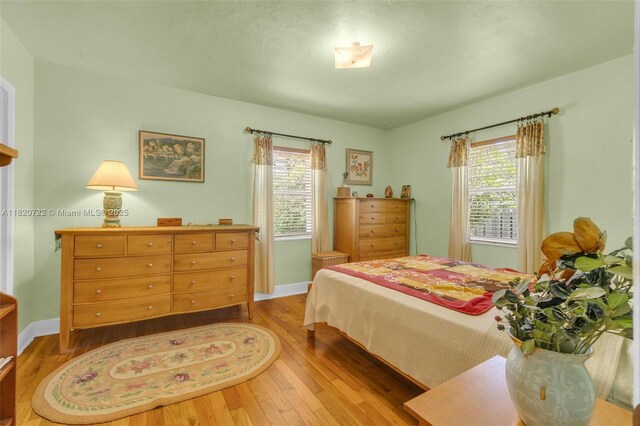 1521 Funston St, Hollywood, FL 33020 - bedroom featuring hardwood / wood-style flooring and multiple windows