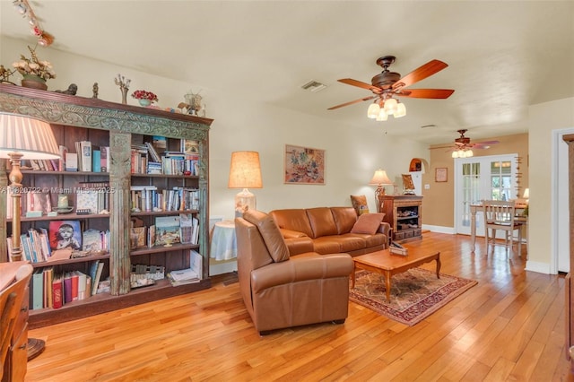 1521 Funston St, Hollywood, FL 33020 - living room with a ceiling fan, light wood finished floors, and a fireplace