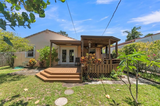 1521 Funston St, Hollywood, FL 33020 - rear view of property with french doors, a wooden deck, ceiling fan, and stucco siding