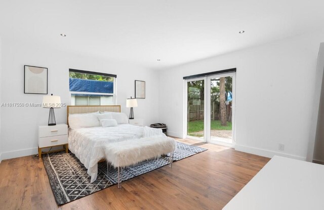 309 SE 3rd Ave, Hallandale Beach, FL 33009 - bedroom with access to outside, multiple windows, wood finished floors, and recessed lighting