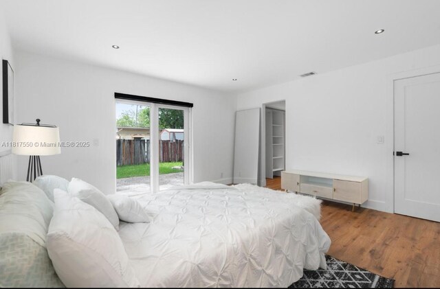 309 SE 3rd Ave, Hallandale Beach, FL 33009 - bedroom featuring access to exterior, wood finished floors, and recessed lighting