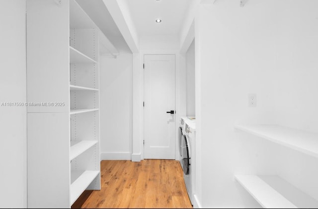 309 SE 3rd Ave, Hallandale Beach, FL 33009 - washroom with light wood-style floors and independent washer and dryer