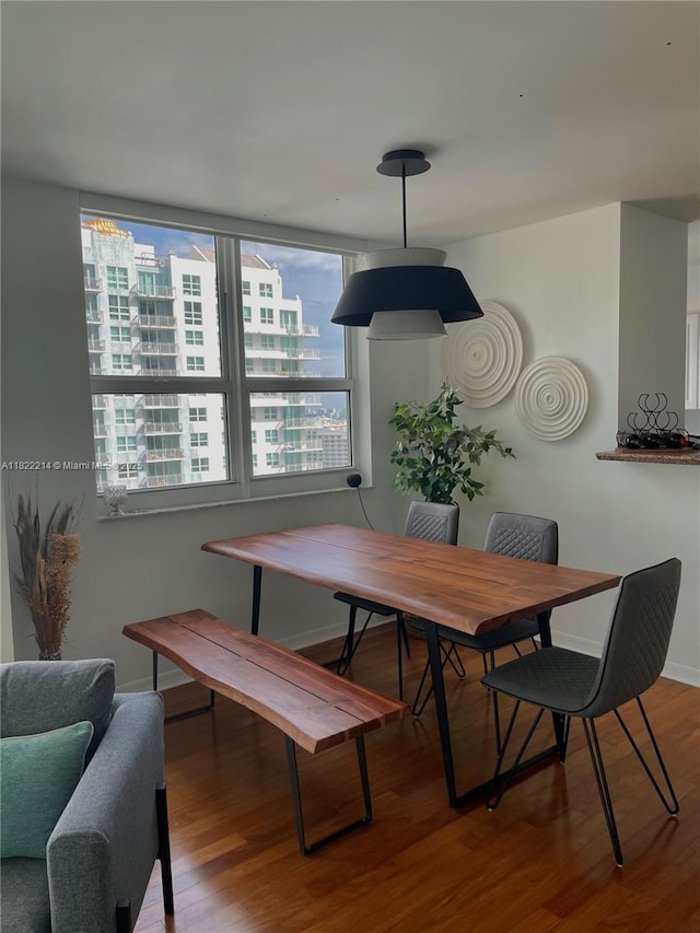 1155 Brickell Bay Dr, Miami, FL 33131 - dining area featuring wood finished floors and baseboards