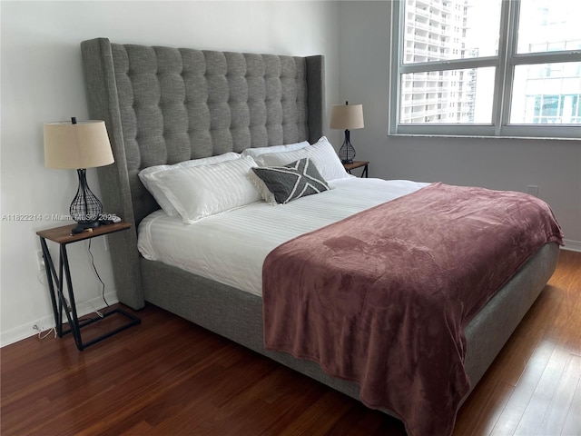1155 Brickell Bay Dr, Miami, FL 33131 - bedroom featuring wood finished floors and baseboards