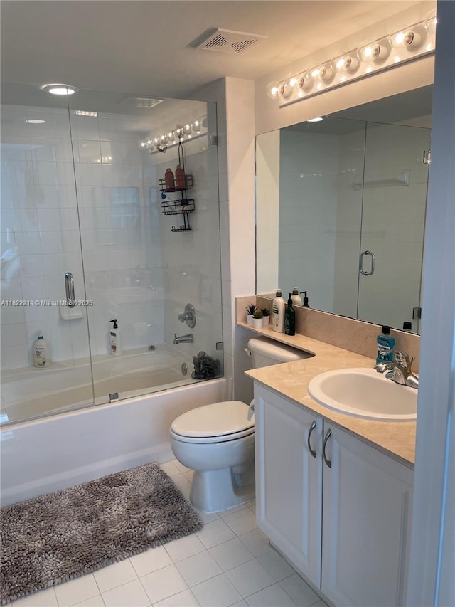 1155 Brickell Bay Dr, Miami, FL 33131 - full bathroom with tile patterned floors, vanity, and enclosed tub / shower combo