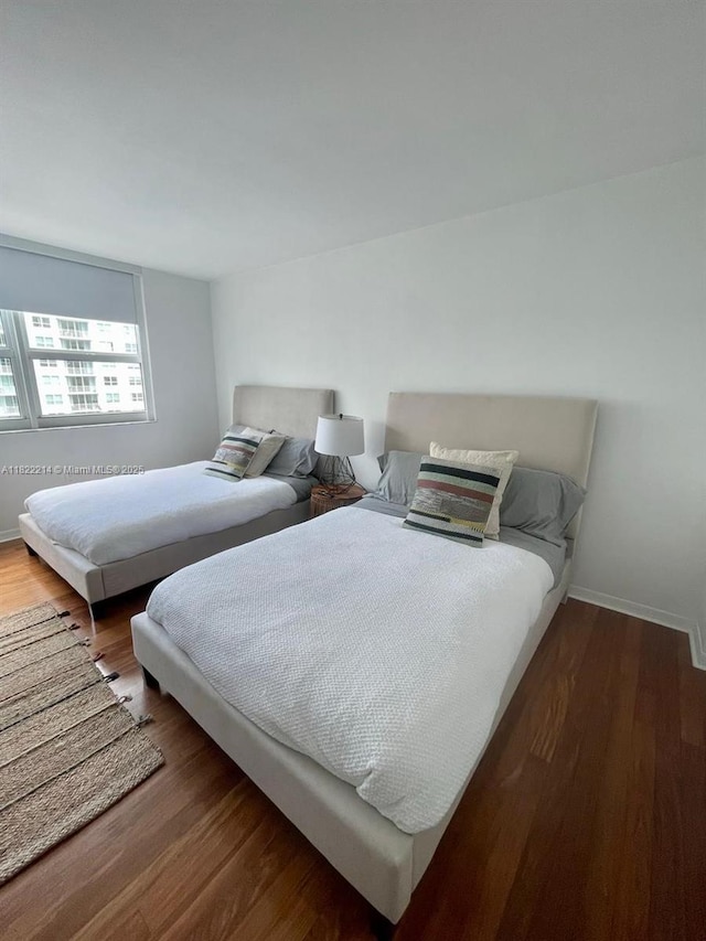 1155 Brickell Bay Dr, Miami, FL 33131 - bedroom with wood finished floors