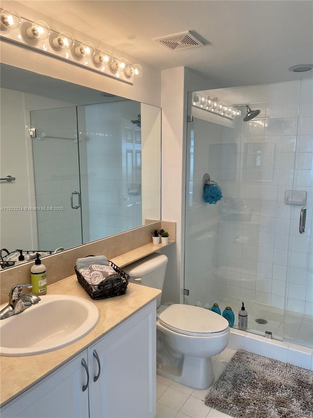 1155 Brickell Bay Dr, Miami, FL 33131 - full bath featuring tile patterned floors, vanity, and a stall shower
