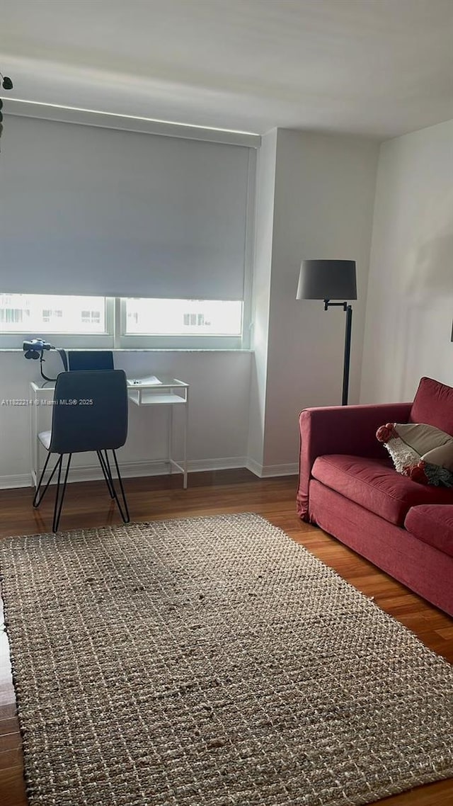 1155 Brickell Bay Dr, Miami, FL 33131 - sitting room featuring wood finished floors and baseboards