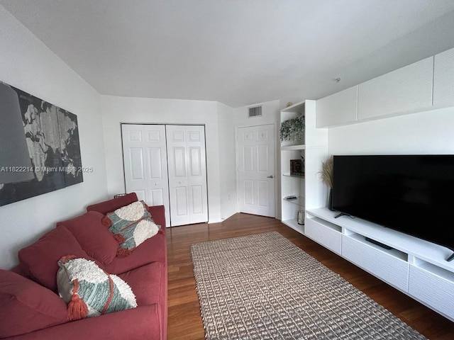 1155 Brickell Bay Dr, Miami, FL 33131 - living area featuring dark wood-type flooring