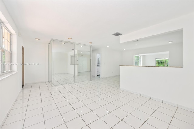 30 E 52nd Pl, Hialeah, FL 33013 - spare room featuring recessed lighting and light tile patterned floors