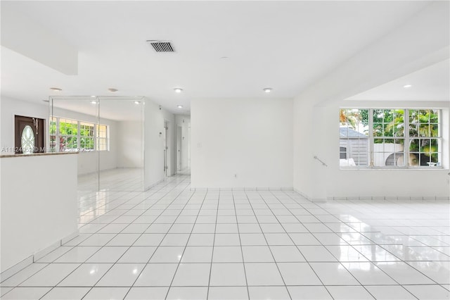 30 E 52nd Pl, Hialeah, FL 33013 - spare room with recessed lighting and light tile patterned flooring