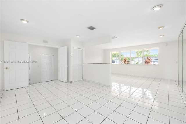 30 E 52nd Pl, Hialeah, FL 33013 - unfurnished room with light tile patterned flooring and recessed lighting
