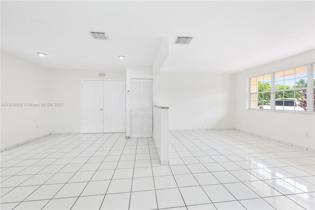 30 E 52nd Pl, Hialeah, FL 33013 - unfurnished room with light tile patterned flooring and recessed lighting