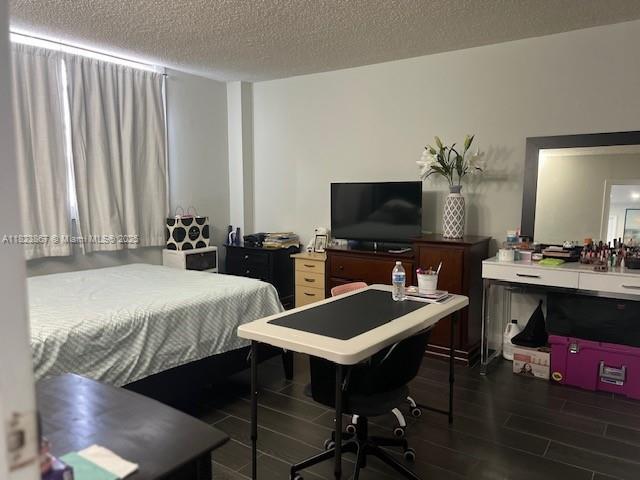 14165 SW 87th St Unit D202, Miami, FL 33183 - bedroom with wood finish floors and a textured ceiling
